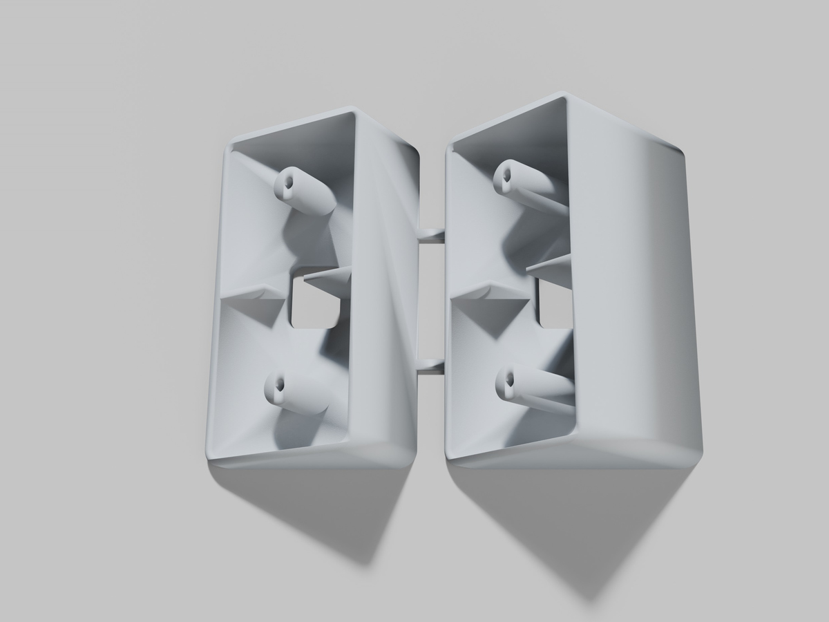 A rendering of a two piece doorbell angle wedge kit for a Ring video doorbell, one 30 degree wedge and one 45 degree wedge joined by two small bars